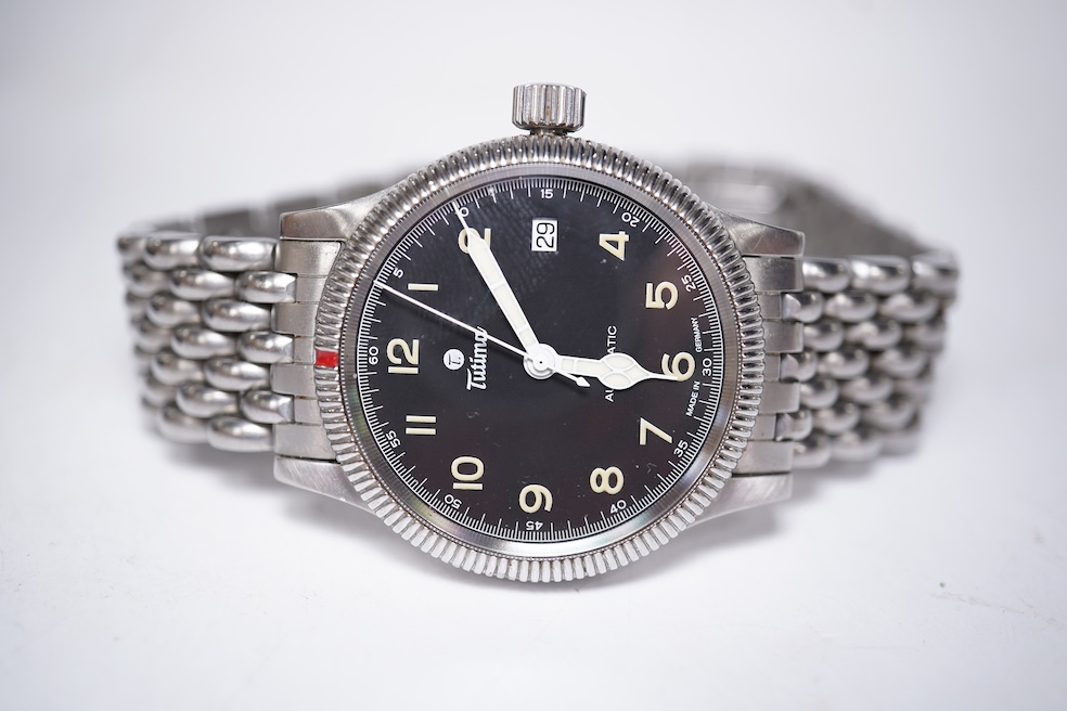 A gentleman's German stainless steel Tutima Flieger Automatic wrist watch, with black Arabic luminous dial and date aperture, cased diameter 36mm, on a stainless steel Tutima bracelet, with box and pamphlet. Condition -